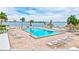 Community pool area with numerous lounge chairs at 6322 Palma Del Mar S Blvd # 209, St Petersburg, FL 33715