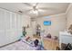 Bedroom with a white dresser and a light purple comforter and stuffed animals at 6388 21St N Ave, St Petersburg, FL 33710