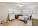 Charming bedroom with white bed frame, and plenty of natural light at 6388 21St N Ave, St Petersburg, FL 33710