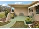 Relaxing front porch with metal seating and potted plants at 6388 21St N Ave, St Petersburg, FL 33710