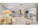 Open living area featuring light and airy furnishings, hardwood floors and a view into another living space at 6388 21St N Ave, St Petersburg, FL 33710