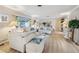 Bright and spacious living room with large windows and comfortable sofas at 6388 21St N Ave, St Petersburg, FL 33710