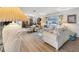 Living area with light beige sofas and a large window at 6388 21St N Ave, St Petersburg, FL 33710
