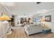 Bright living room featuring light colored sofas and hardwood floors at 6388 21St N Ave, St Petersburg, FL 33710