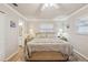 Bright main bedroom with king-size bed and ensuite bathroom at 6388 21St N Ave, St Petersburg, FL 33710