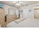 Main bedroom with king bed, dresser, and access to bathroom at 6388 21St N Ave, St Petersburg, FL 33710