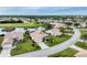 Community overview with golf course and lake views at 6769 Greenview Ln, Englewood, FL 34224