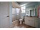 Clean bathroom with tub shower combo and updated vanity at 6769 Greenview Ln, Englewood, FL 34224