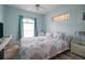 Spacious bedroom with a king-size bed and large window at 6769 Greenview Ln, Englewood, FL 34224