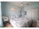 Bedroom with king bed, window seat, and built-in shelving at 6769 Greenview Ln, Englewood, FL 34224