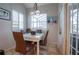 Kitchen breakfast nook with glass-top table and four chairs at 6769 Greenview Ln, Englewood, FL 34224