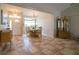 Elegant dining room with a chandelier and hardwood floors at 6769 Greenview Ln, Englewood, FL 34224