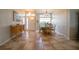 Bright dining area featuring a table and chairs near the entryway at 6769 Greenview Ln, Englewood, FL 34224