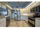 Modern kitchen, equipped with stainless steel appliances and granite countertops at 6769 Greenview Ln, Englewood, FL 34224