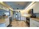 Bright kitchen with stainless steel appliances and granite countertops at 6769 Greenview Ln, Englewood, FL 34224