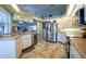Updated kitchen featuring stainless steel appliances and granite countertops at 6769 Greenview Ln, Englewood, FL 34224