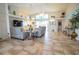 Bright living room featuring vaulted ceilings and comfy seating at 6769 Greenview Ln, Englewood, FL 34224