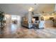 Open floor plan connecting living room to kitchen and dining areas at 6769 Greenview Ln, Englewood, FL 34224
