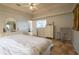 Comfortable main bedroom with ceiling fan and plenty of closet space at 6769 Greenview Ln, Englewood, FL 34224
