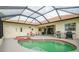 Relaxing pool and spa area with covered patio and grill at 6769 Greenview Ln, Englewood, FL 34224