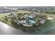 Aerial view of community with lake and resort-style pool at 7401 Paradiso Dr, Apollo Beach, FL 33572