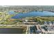 Aerial view of community with lake, pool, tennis courts, and playground at 7401 Paradiso Dr, Apollo Beach, FL 33572