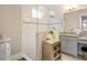 Bathroom with granite vanity, walk-in shower, and modern fixtures at 7401 Paradiso Dr, Apollo Beach, FL 33572
