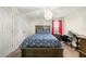 Bedroom with double bed, desk, and plenty of closet space at 7401 Paradiso Dr, Apollo Beach, FL 33572