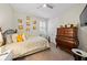 Bedroom with dresser, ceiling fan, and plenty of natural light at 7401 Paradiso Dr, Apollo Beach, FL 33572