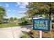 Fenced dog park with benches and a sign at 7401 Paradiso Dr, Apollo Beach, FL 33572