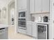 Kitchen features stainless steel appliances and wine cooler at 7401 Paradiso Dr, Apollo Beach, FL 33572