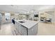 Large kitchen island with sink and breakfast bar at 7401 Paradiso Dr, Apollo Beach, FL 33572