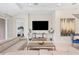 Open living space with sectional sofa and large TV at 7401 Paradiso Dr, Apollo Beach, FL 33572