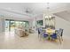 Spacious living room with L-shaped sofa and dining area at 7401 Paradiso Dr, Apollo Beach, FL 33572