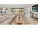 Living room with large sectional sofa and access to backyard at 7401 Paradiso Dr, Apollo Beach, FL 33572