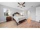Main bedroom with wood floors and ceiling fan at 7401 Paradiso Dr, Apollo Beach, FL 33572