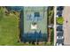 Aerial view of community pickleball courts and surrounding green space at 7401 Paradiso Dr, Apollo Beach, FL 33572