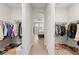 Large walk-in closet with ample hanging space and shelving at 7401 Paradiso Dr, Apollo Beach, FL 33572