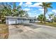 Front view of the house with driveway and garage at 809 Audubon St, Clearwater, FL 33764