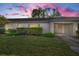 Front view of charming house with well-maintained landscaping at 8236 Brentwood Rd, Seminole, FL 33777