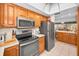 Modern kitchen featuring stainless steel appliances and ample cabinetry at 8236 Brentwood Rd, Seminole, FL 33777