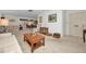 Open living room with a view into the dining area and ample natural light at 8236 Brentwood Rd, Seminole, FL 33777