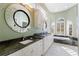 Elegant bathroom with granite countertops and double vanity at 843 Harbor Is, Clearwater Beach, FL 33767