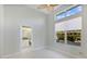 Bright bedroom with ensuite bathroom access and large windows at 843 Harbor Is, Clearwater Beach, FL 33767