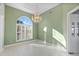 Spacious dining room with an arched window and chandelier at 843 Harbor Is, Clearwater Beach, FL 33767
