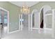 Elegant dining room with high ceilings, columns and hardwood floors at 843 Harbor Is, Clearwater Beach, FL 33767