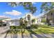 Grand two-story home boasts attractive landscaping and a three-car garage at 843 Harbor Is, Clearwater Beach, FL 33767