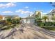 Two-car garage and manicured landscaping enhance this home's curb appeal at 843 Harbor Is, Clearwater Beach, FL 33767