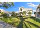 Luxury home with lush landscaping and palm trees, offering curb appeal at 843 Harbor Is, Clearwater Beach, FL 33767