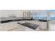 Modern kitchen with granite countertops and island at 843 Harbor Is, Clearwater Beach, FL 33767